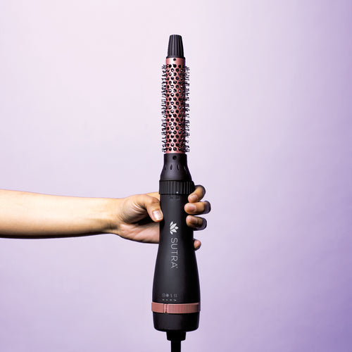 Hand-holding-one-inch-diameter-brush-attached-to-interchangeable-base