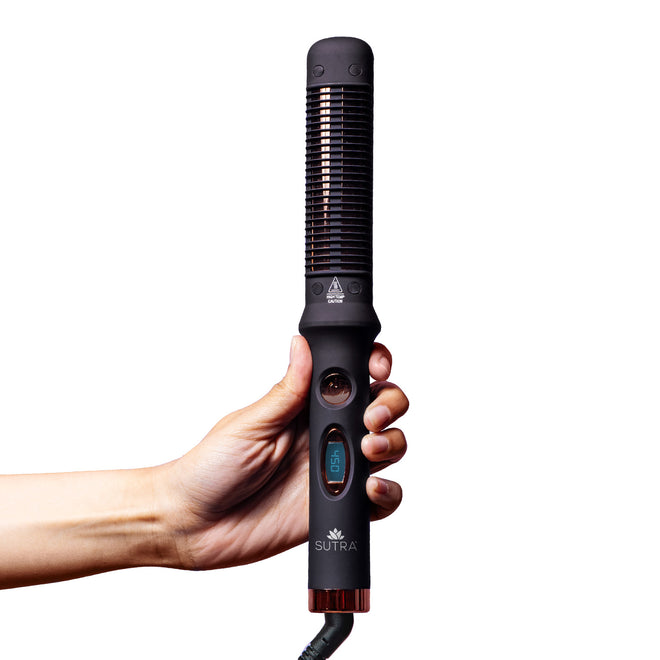 Hand-holding-black-glider-pro-styling-comb-on-a-white-background