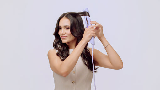 woman with brown hair curling with the SUTRA flat iron