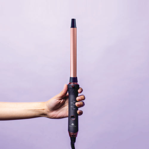 hand-holding-interchangeable-curler-base-with-19mm-clipless-barrel-attached