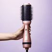 hand-holding-rose-gold-2-inch-professional-blowout-brush
