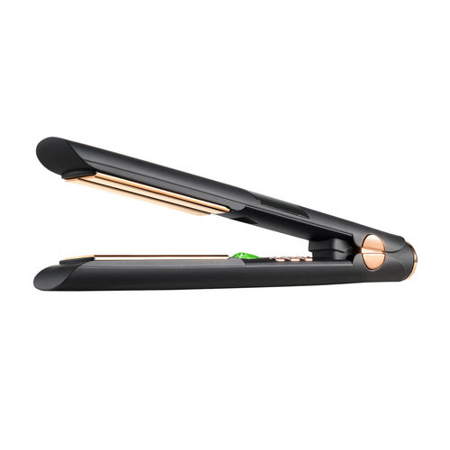 A black flat iron with gold color details  on a white background