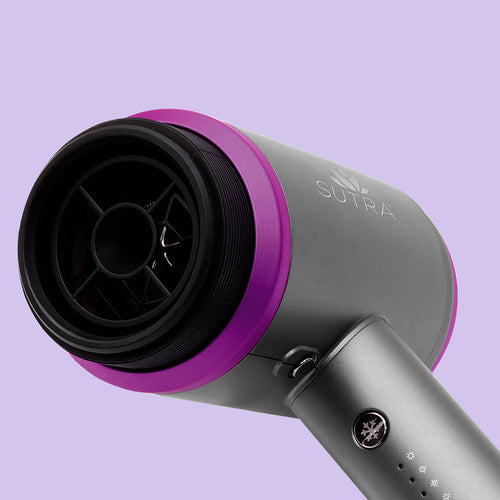 close-up-of-silver-and-magenta-blow-dryer-showing-motor