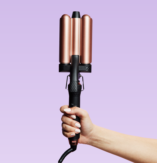 Hand-holding-interchangeable-curler-base-with-waver-attached